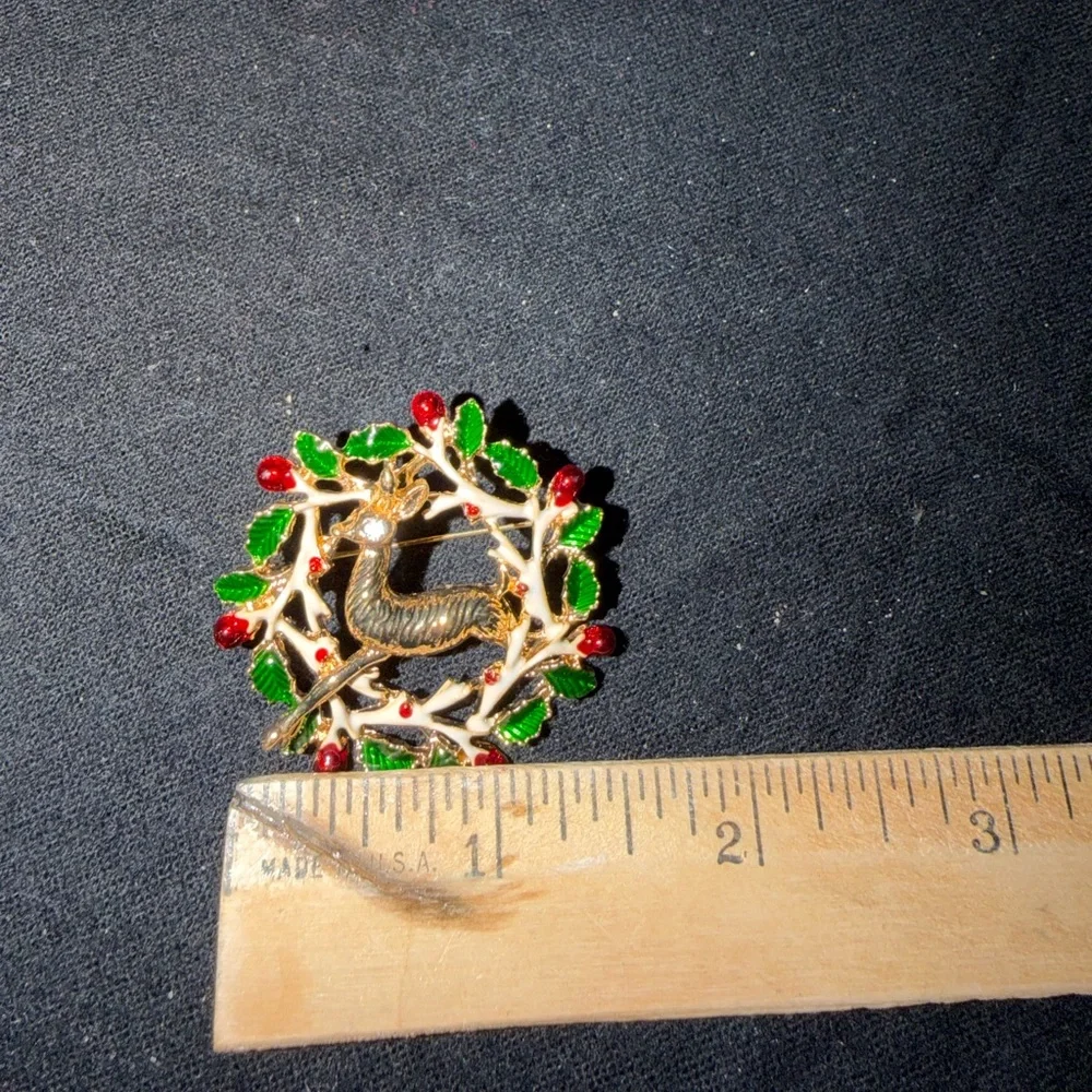 Elegant Gold Reindeer Brooch with Green and Red Accents